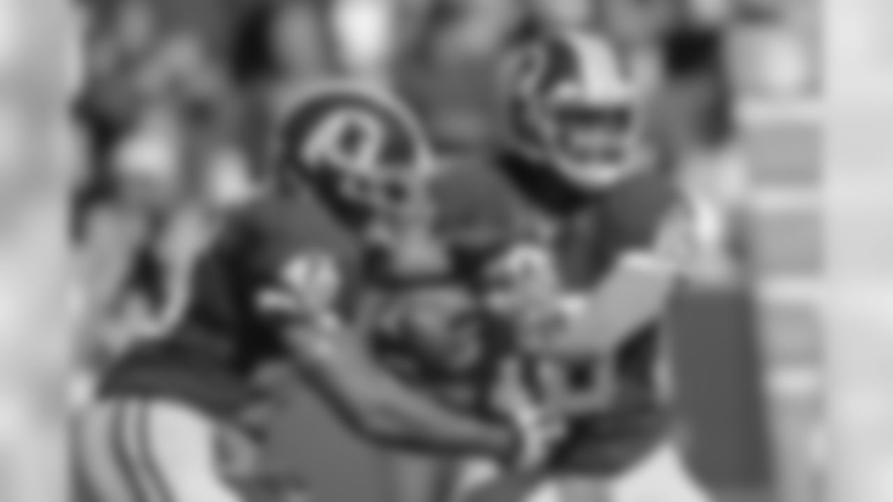 No. 6- Redskins quarterback Robert Griffin III reads the defense as he chooses to keep or hand the ball off to running back Alfred Morris.