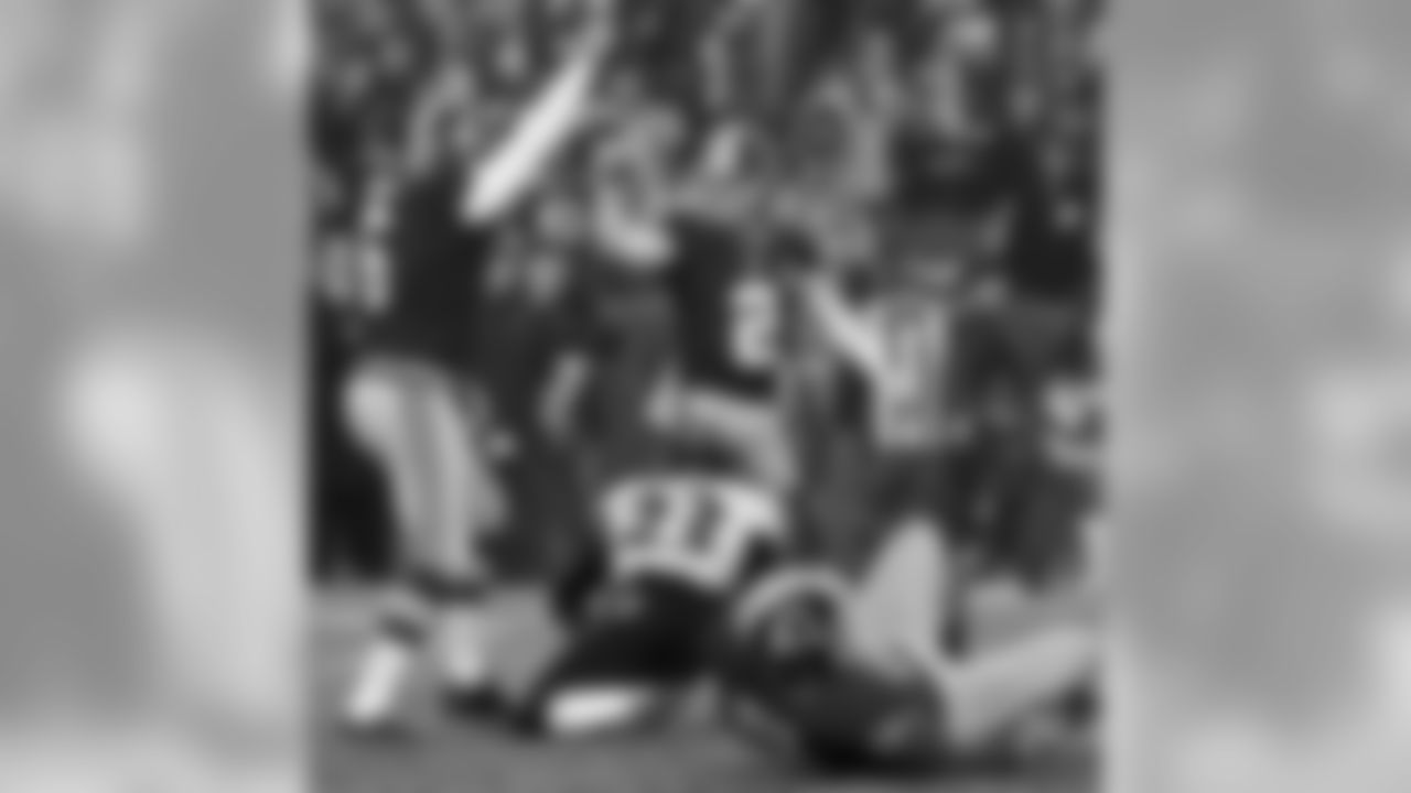 Redskins K Kai Forbath and P Sav Rocca celebrate after a game-winning field goal.