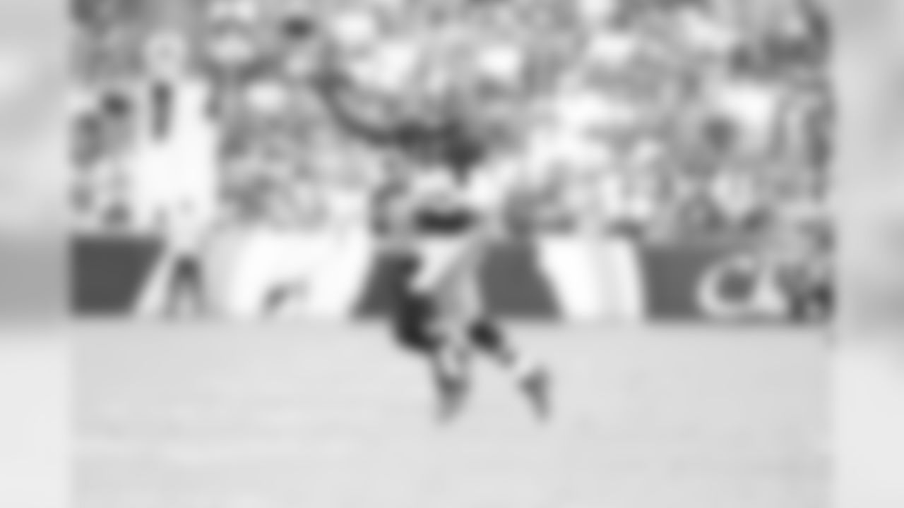 No. 11- Robert Griffin III throws on the run vs. the Lions, Griffin had his third straight game with over 300 yards passing and second highest passing yard game this season with 326 on Sunday, Sep. 22, 2013 at Landover, Md.