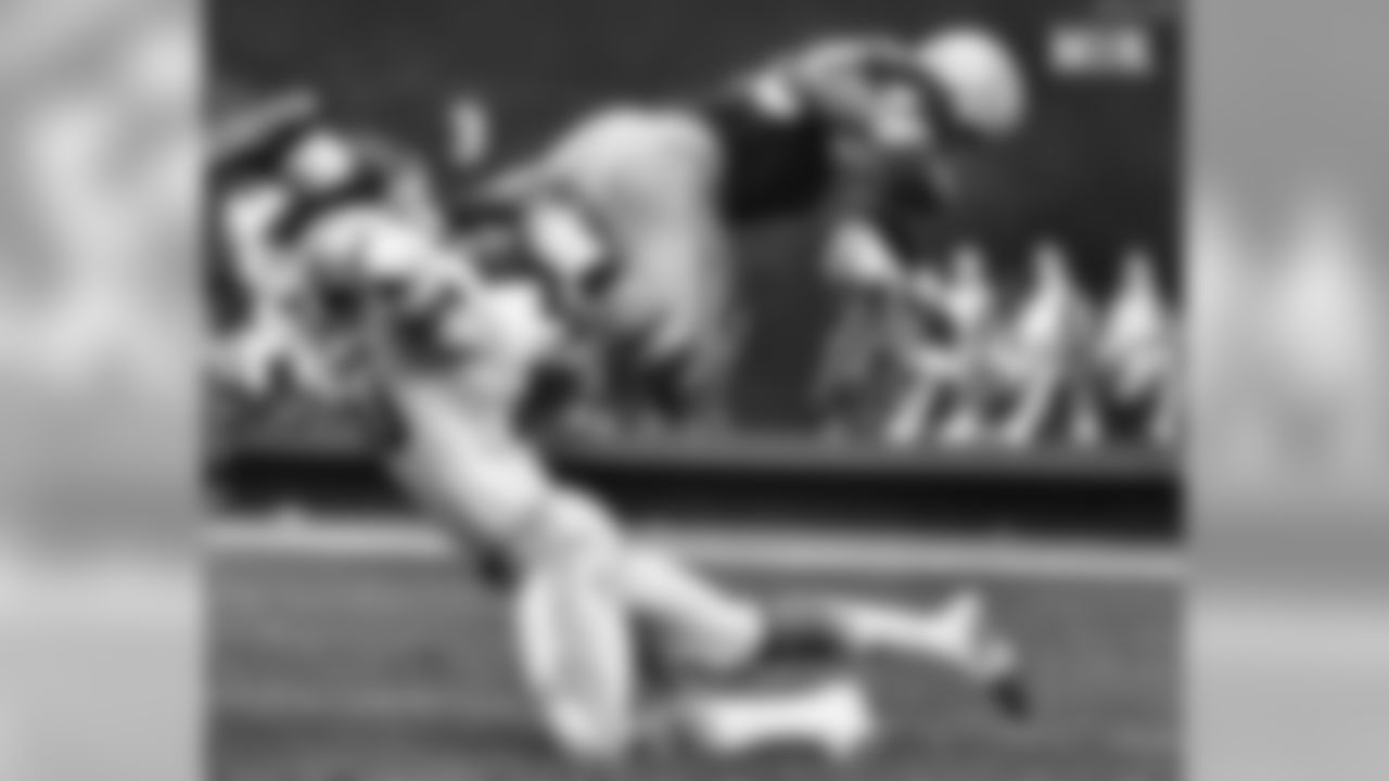 1970 - Lem Barney of the Detroit Lions grabs Larry Brown of the Washington Redskins by the leg to bring him down after an 11-yard gain in the fourth period of NFL play in Washington, Oct. 11, 1970. Washington upset the Lions, 31-10. (AP Photo)