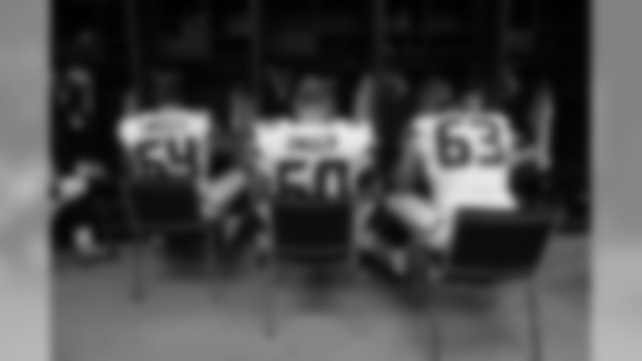 In the locker room, linemen J.R. Sweezy, Max Unger and Stephen Schilling