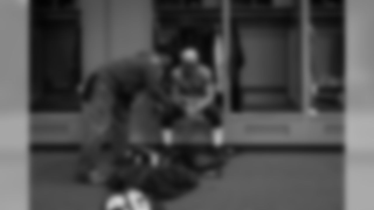 4:45pm. Safety and heart-and-soul of the Seahawks Earl Thomas III sits at his locker as his father Earl Thomas offers a quiet word before leaving his son alone with his thoughts.