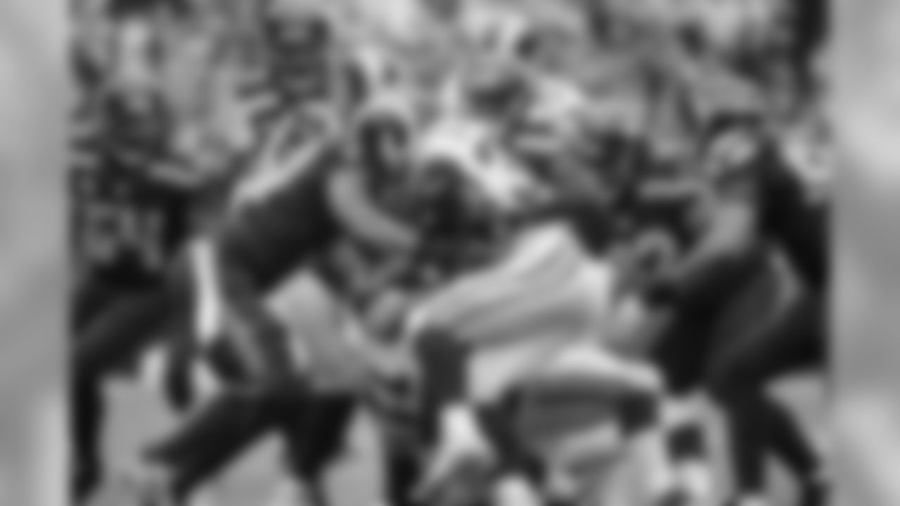 Safety Kelcie McCray stops St. Louis running back Todd Gurley with the help of linebacker Bruce Irvin.