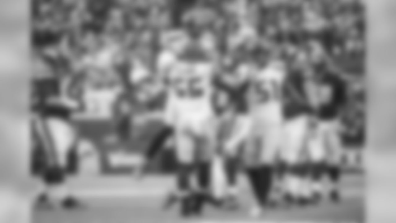 Seattle's defense came out on fire, and Bobby Wagner and Bruce Irvin congratulate Frank Clark after his sack of Minnesota quarterback Teddy Bridgewater in the first quarter.