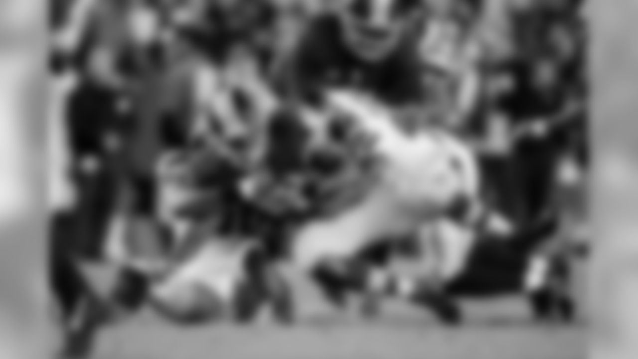 Seattle's K.J. Wright and O'Briend Schofield combine to bring down Washington's Alfred Morris in the first quarter.