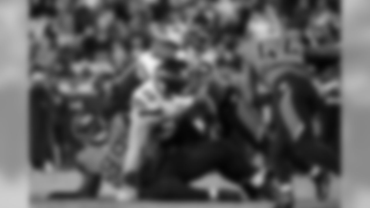 Seahawks running back Mike Davis climbs over a pile of players including center Justin Britt in the third quarter.