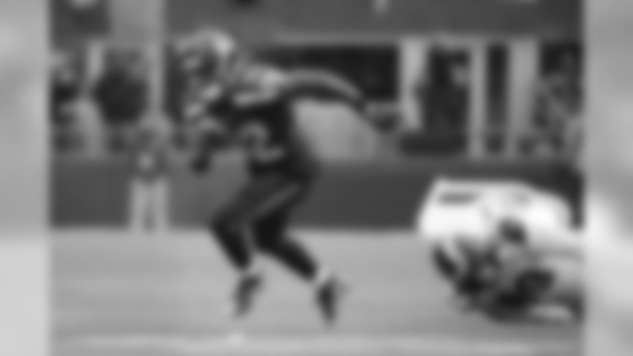 Running back Christine Michael heads up the right side after eluding St. Louis defender Aaron Donald.