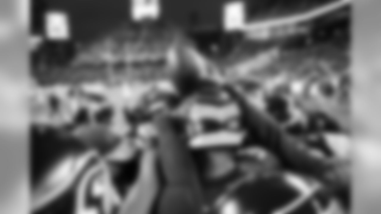 The Seahawks defensive backs huddle together during pregame.