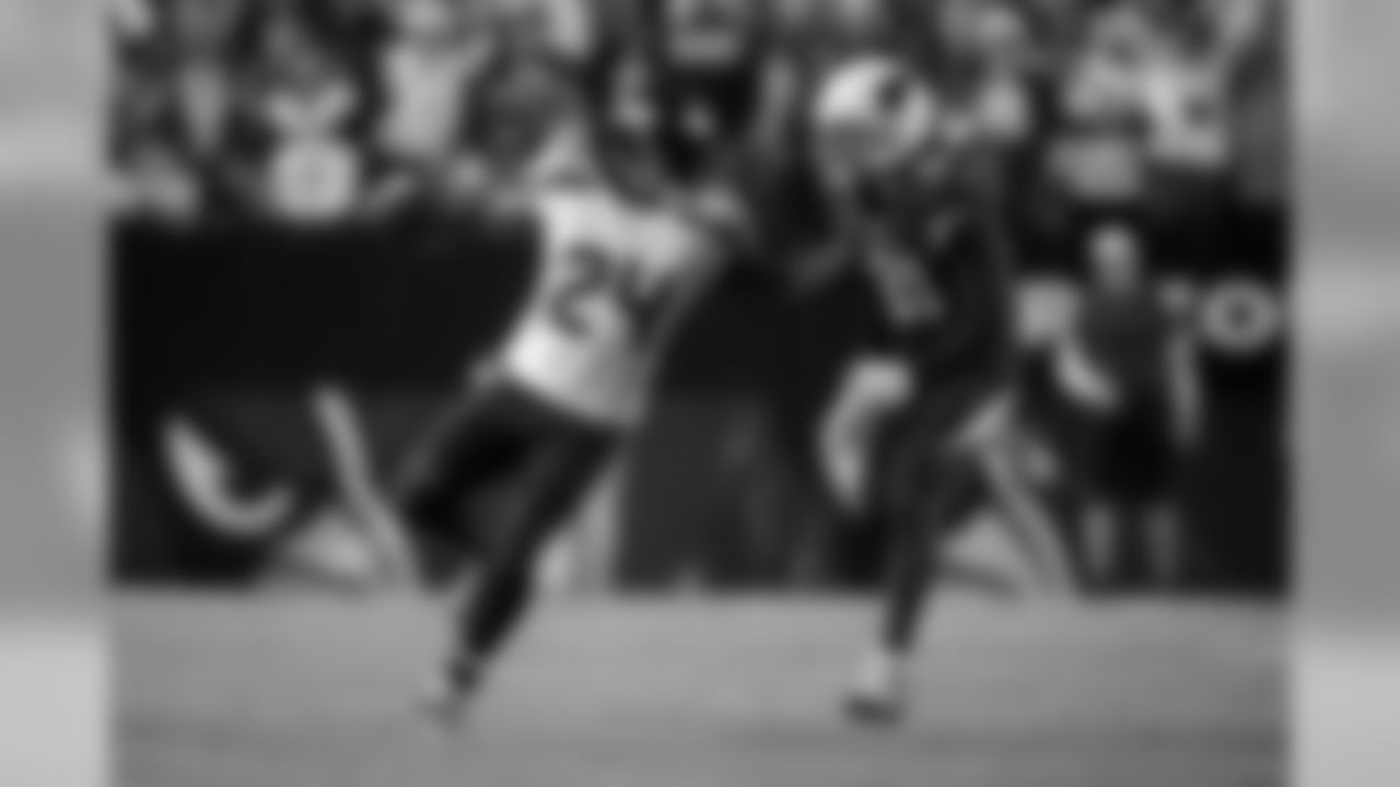 Lynch decides to engage Peterson, and uses his left hand to push the defender away as he cuts back.