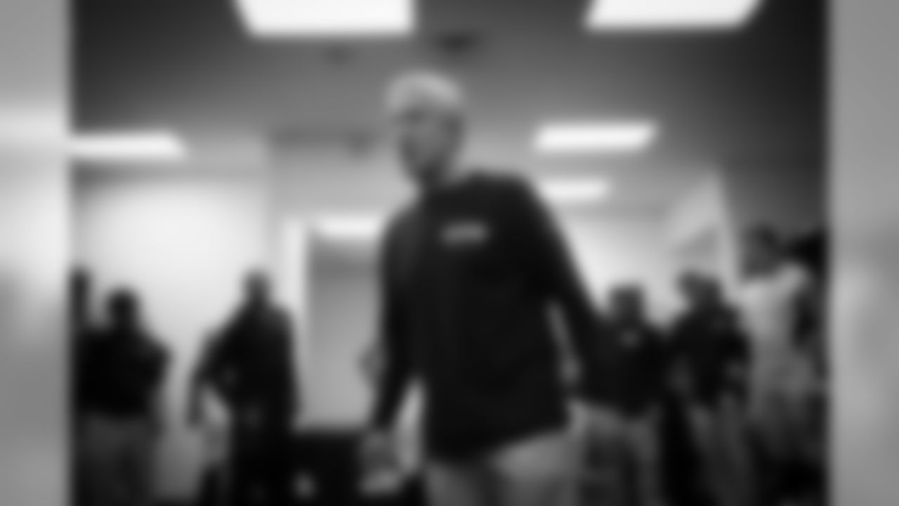 Head coach Pete Carroll gives the team his postgame comments in the locker room.