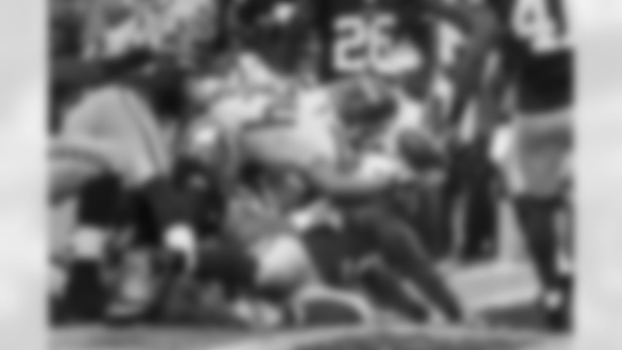 Marshawn Lynch reaches the ball over the goal line for the Seahawks opening touchdown. Beneath him is center Drew Nowak whose blocking helped lead the way.