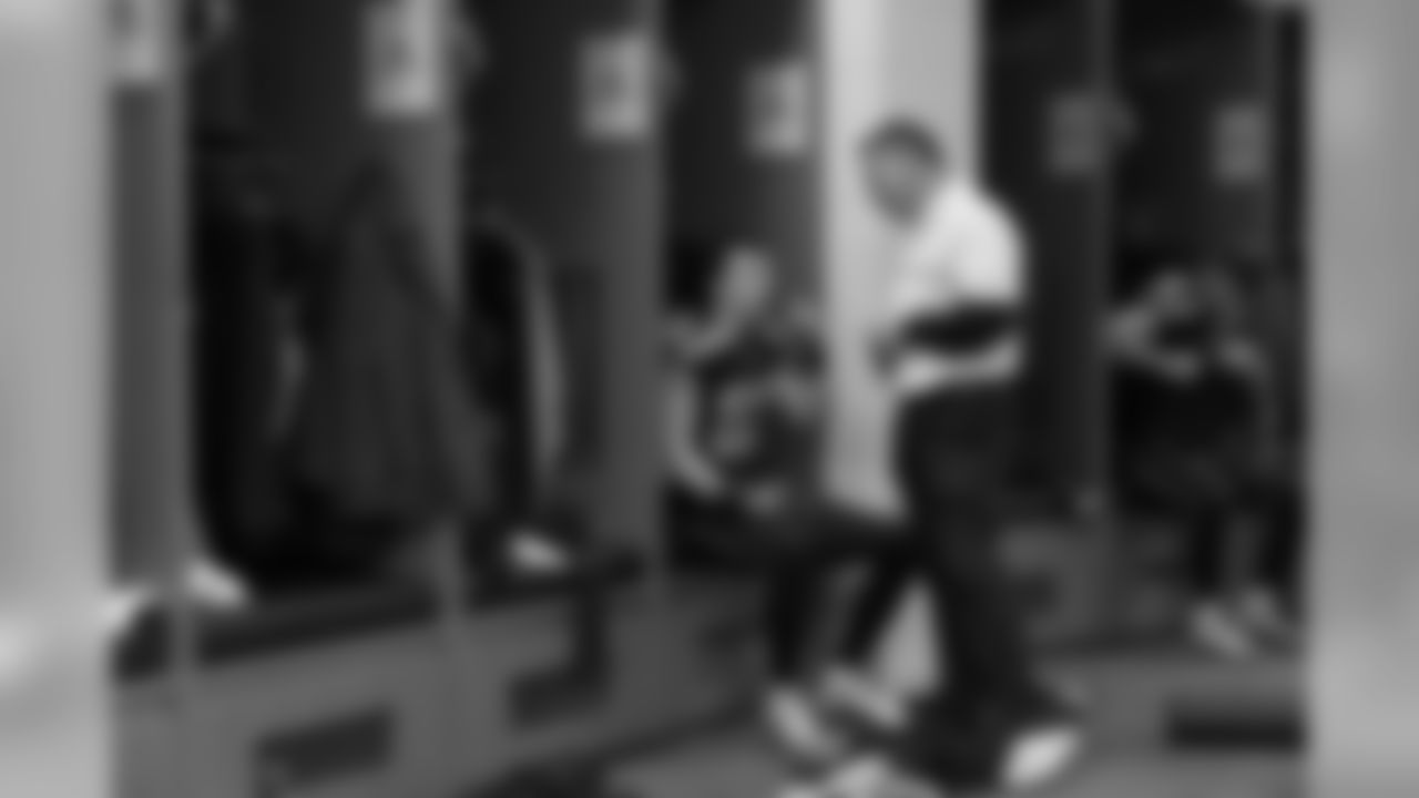 Tight end Luke Willson listens to position coach Pat McPherson in the locker room before kickoff.