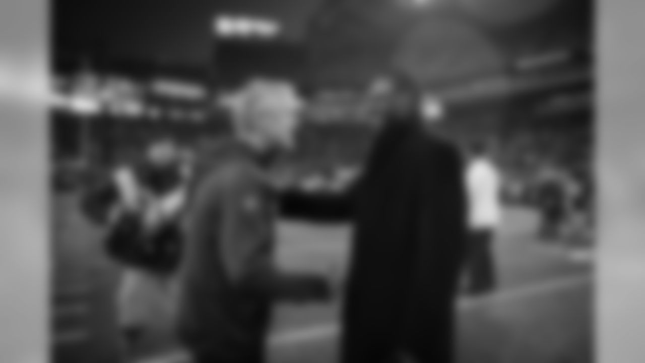 Head coach Pete Carroll chats with Seahawks legend and Ring of Honor member Kenny Easley before the game. Easley raised the 12 Flag before the game.