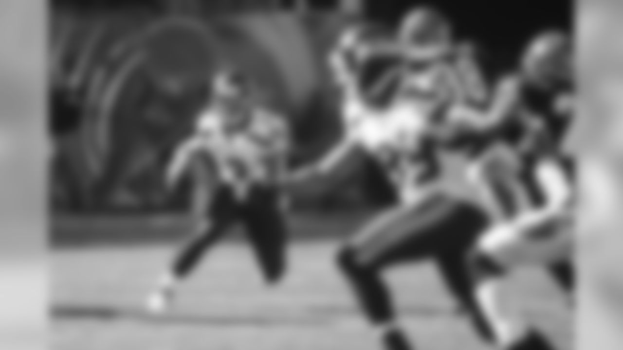 Quarterback Russell Wilson scrambles as receiver Doug Baldwin makes a break towards the center of the field.