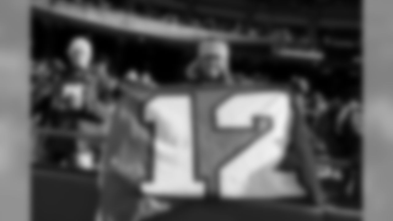 Seahawks fan Bobby Kulvanish proudly displays is 12 flag from the first row, and even had weather-appropriate headwear for the frigid game.