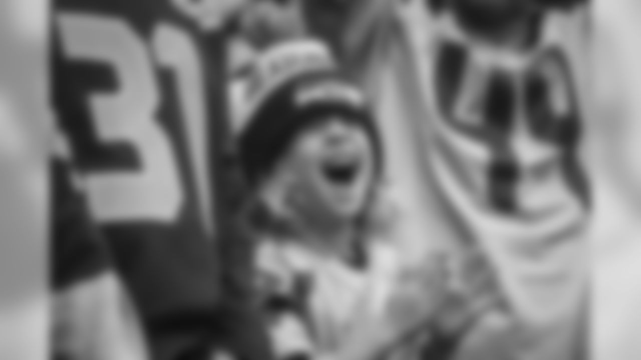 A young fans is excited as the Seahawks are introduced.