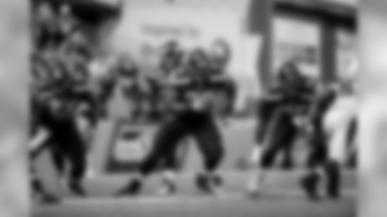 The left side of Seattle's offensive line fires out after the snap with center Patrick Lewis, guard Alvin Bailey and tackle Russell Okung looking to make their blocks.