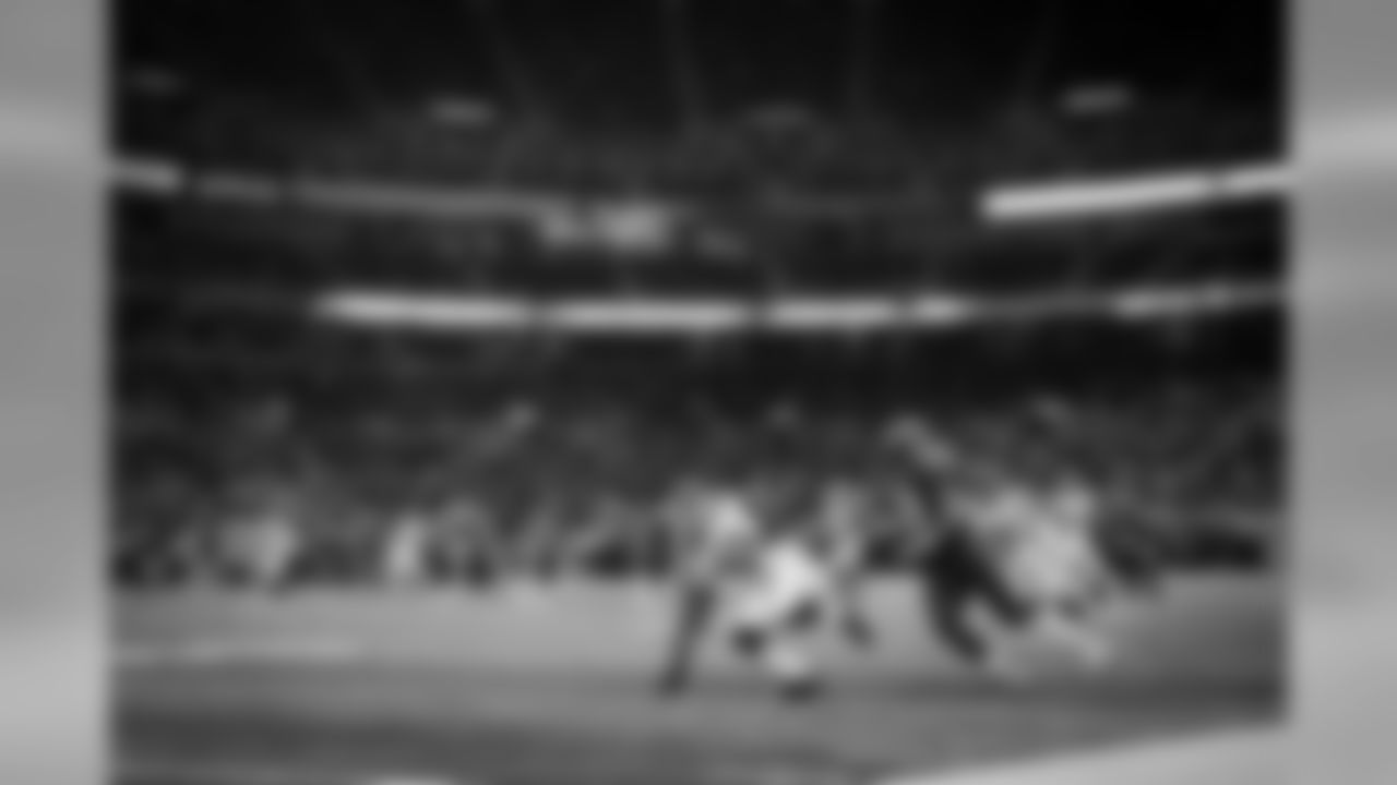 Linebacker Bruce Irvin steadies himself after intercepting his first pass as a pro. The upper regions of the Edward Jones Dome were sparsely occupied as St. Louis was also hosting Game 5 of the World Series on Monday night.