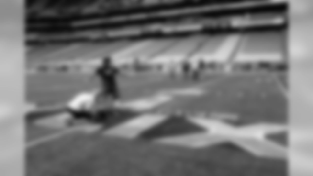 THURSDAY - JAN 29 -- Each team in the Super Bowl is allowed a short window of time in the stadium for its specialists (punters and place kickers) to come in, check the surroundings and take some kicks. Jon Ryan holds as Steven Hauschka kicks a field goal on the field at University of Phoenix Stadium.