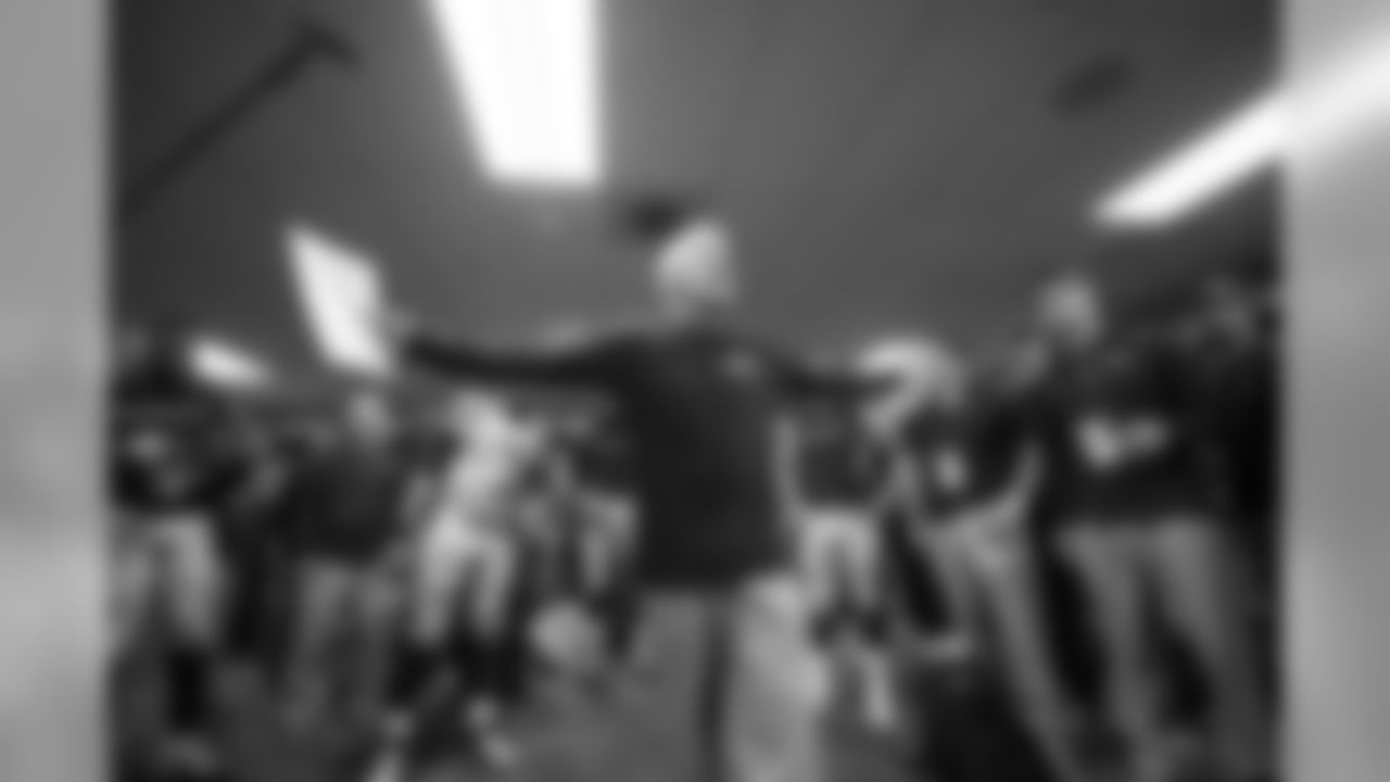 Head coach Pete Carroll talks to his team about the victory, which helps the Seahawks position themselves for a playoff run in the final weeks of the regular season.