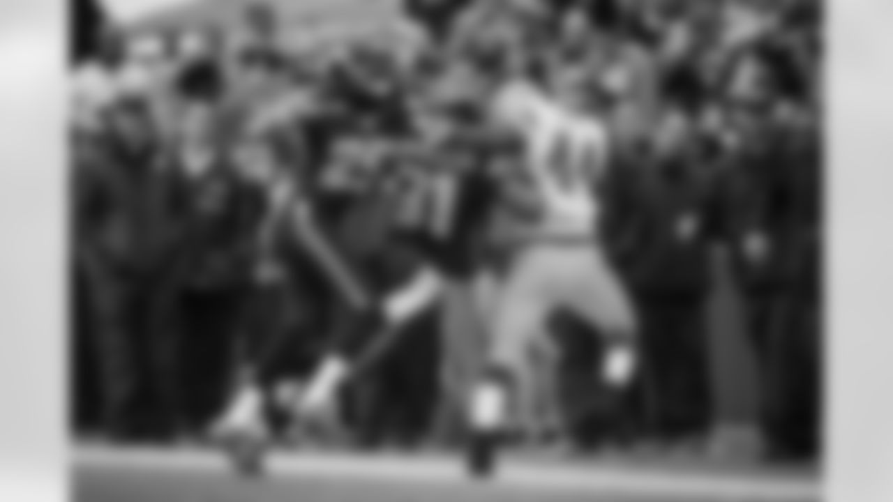 Cornerback Richard Sherman injured his left elbow on this play as he and safety Kam Chancellor combine to knock Green Bay's James Starks out-of-bounds along the Seattle sideline.