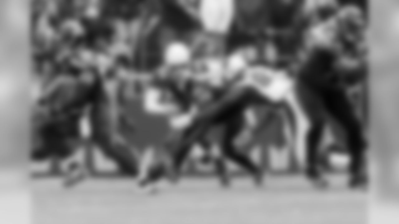 Seattle's Marcel Reese looks to recapture a fumble in the first quarter that led to a turnover.