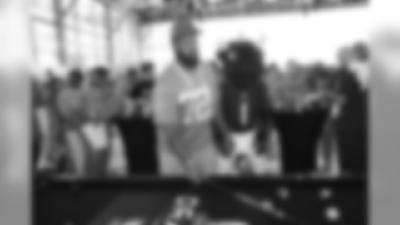 Seattle Seahawks defensive end Michael Bennett (72) plays a game of pool at the NFL Pro Bowl football draft at Wheeler Army Airfield, Wednesday, Jan. 27, 2016, in Wahiawa, Hawaii. (AP Photo/Marco Garcia)