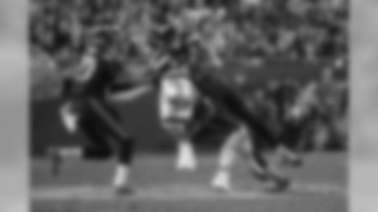 Safety Kam Chancellor levels Patriots receiver Julian Edelman on a crossing route in the second half.