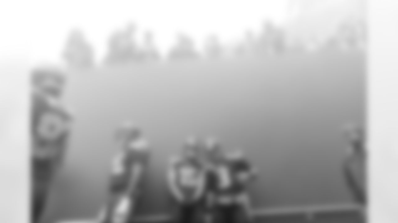 Pressure? None here. Russell Wilson and Jermaine Kearse find a moment to pose for a photo amid the fog and bedlam of pregame introductions.