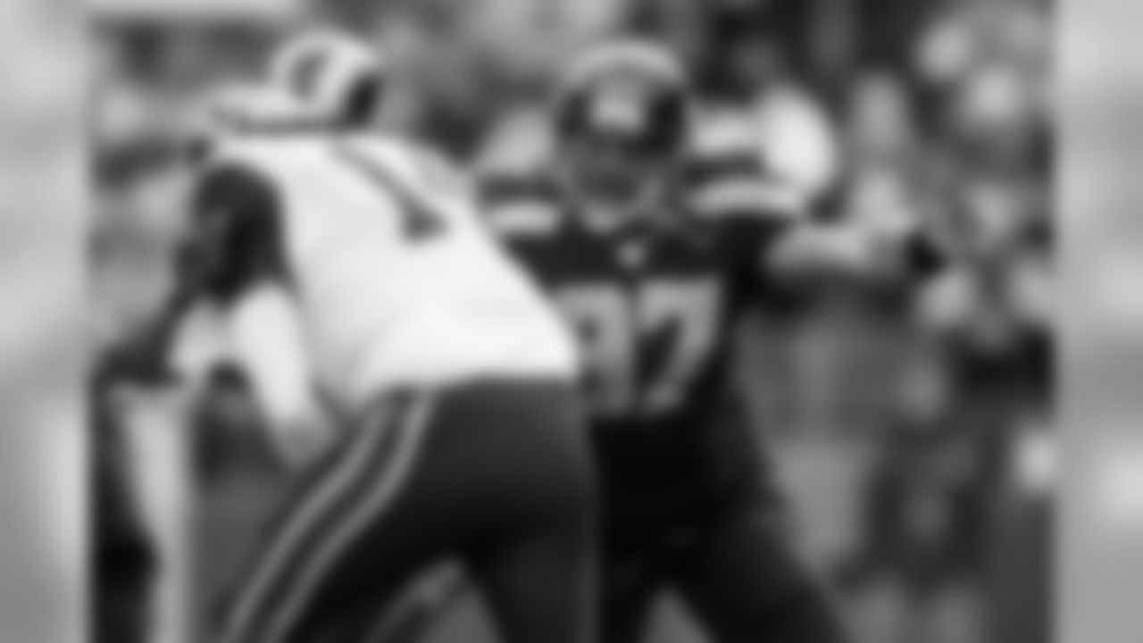 Defensive lineman Jordan Hill closes in to sack Rams quarterback Shaun Hill for a 10-yard loss.