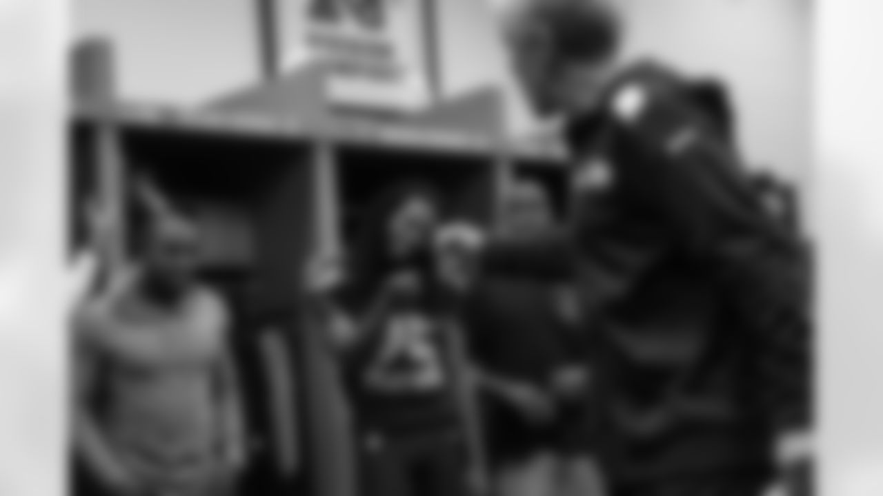 Cornerback Richard Sherman acknowleges Pete Carroll during the team's postgame meeting.