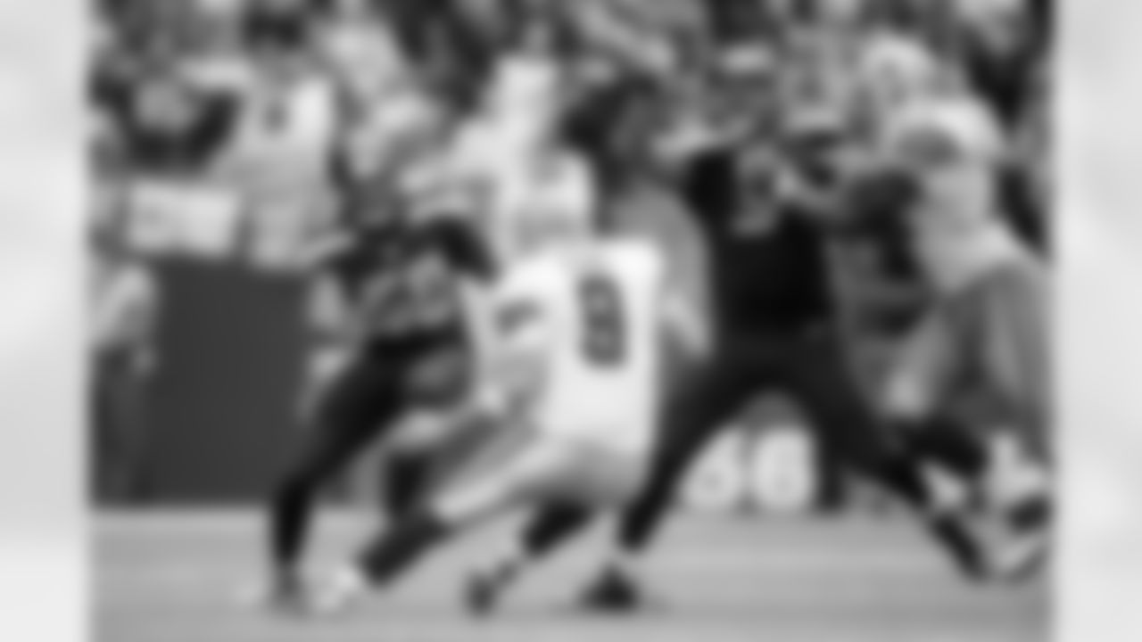 Tony Romo showed good movement in and out of the pocked as he is pursued by Seattle's K.J. Wright and Kevin Williams on this play.