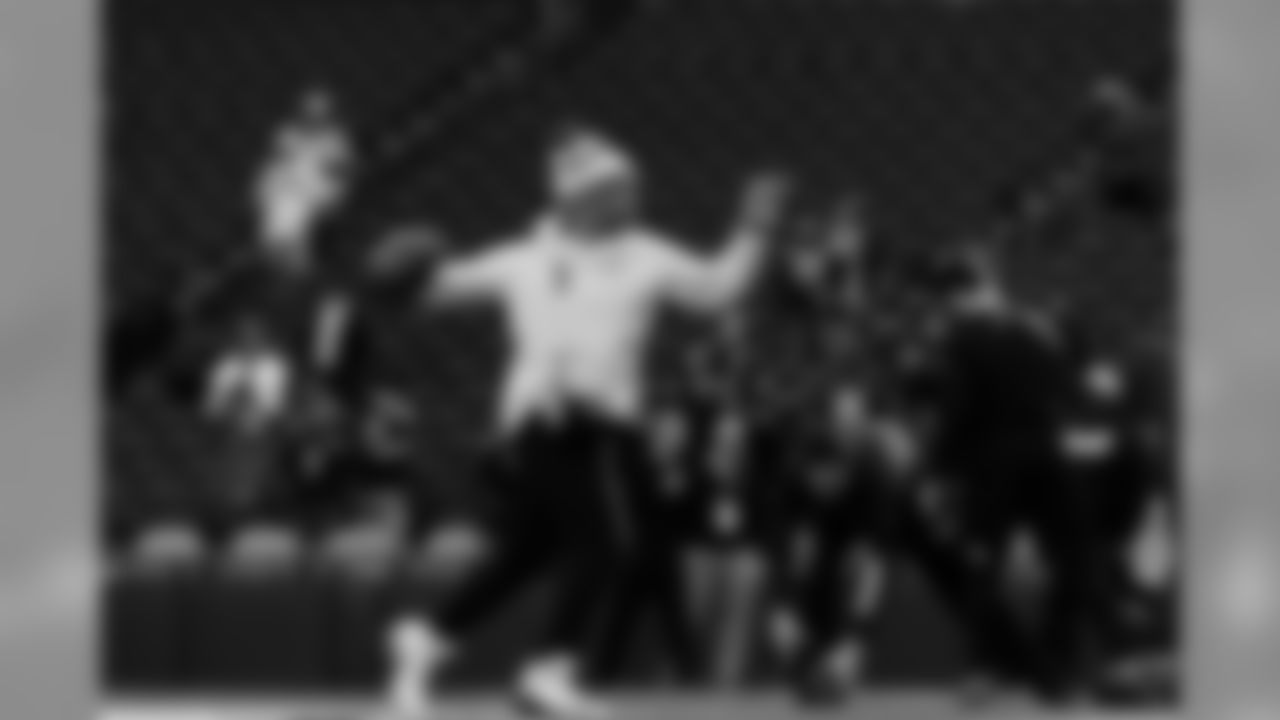 Quarterback Russell Wilson warms up before the game.