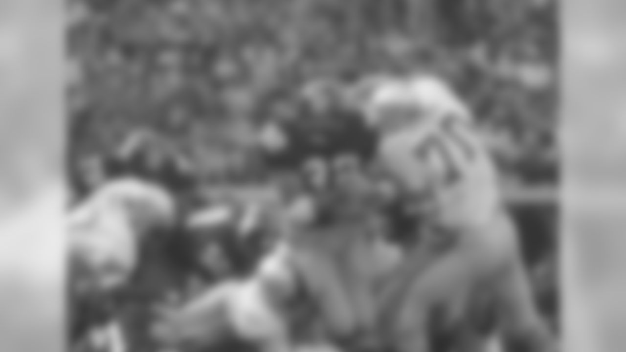 Franco Harris of the Steelers carried for short yardaga in first quarter action Sunday, Dec. 4, 1977 past Seattle Seahawks Bob Lurtsema (70). Harris rushed for more than 100 yards for the twenty-eight time in his career, only two other players have done it more often. Harris also went over the 1000 yard mark for the year. (AP Photo)