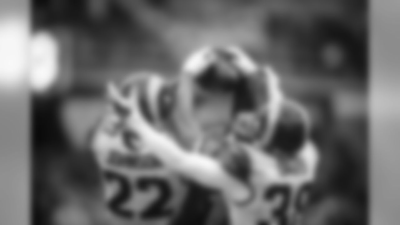 Seattle's Tyler Lockett battled St. Louis defensive backs Truman Johnson and Cody Davis for a deep ball thrown by Russell Wilson but Johnson came away with an interception and Lockett was banged up on the play.
