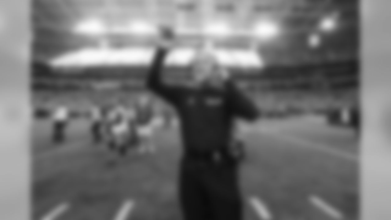 Head coach Pete Carroll waves to family members after taking the field with his team during pregame ceremonies.