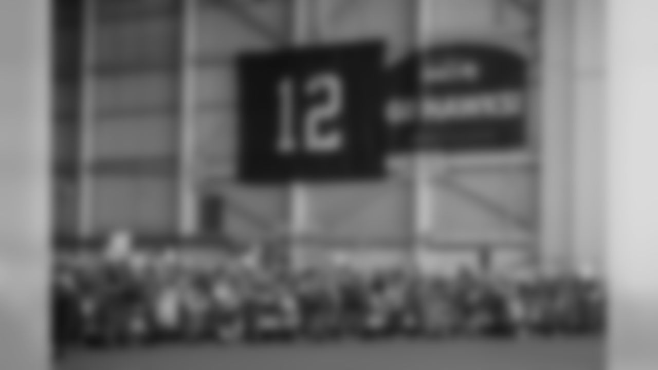 Delta employees and their friends and families jammed the hangar next to the Seahawks charter to send the team off.
