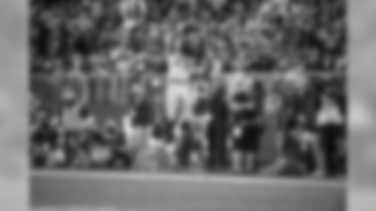 Richard Sherman's face is obscured by his braids, but he still managed to intercept this pass by Colin Kaepernick in front of the 49ers sideline in the fourth quarter.