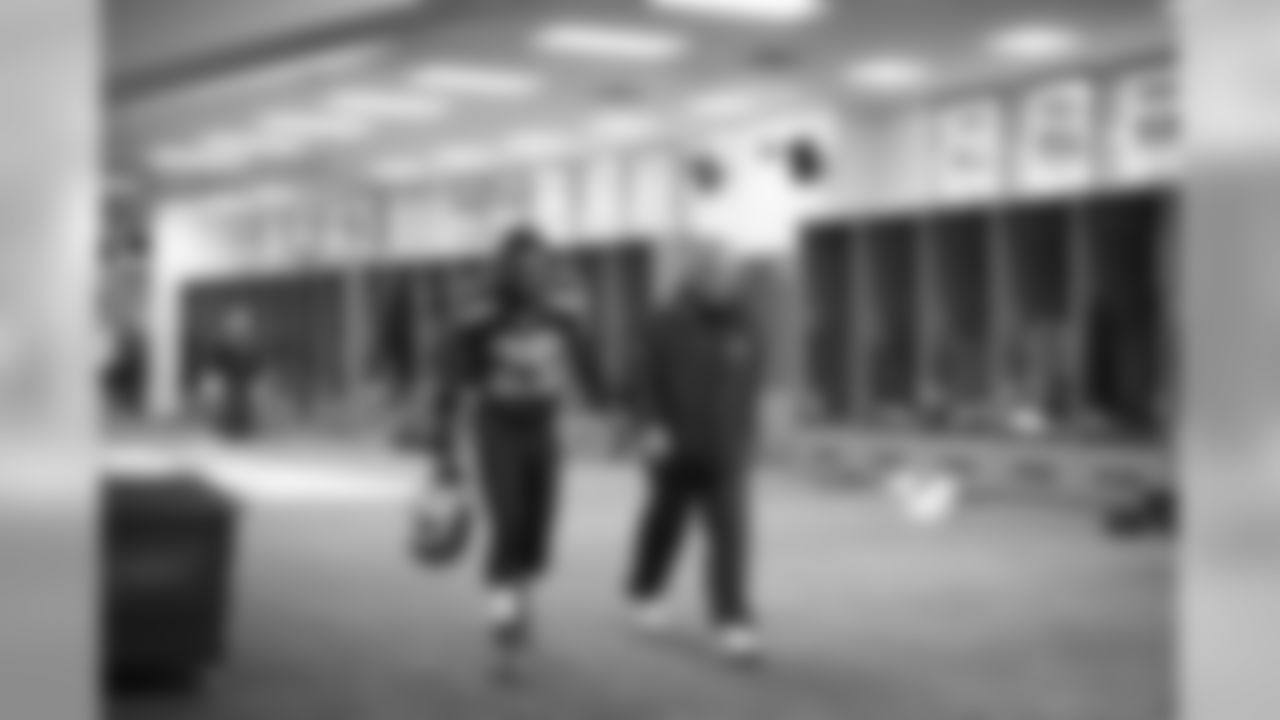 Safety Earl Thomas and head coach Pete Carroll leave the locker room at the end of halftime.