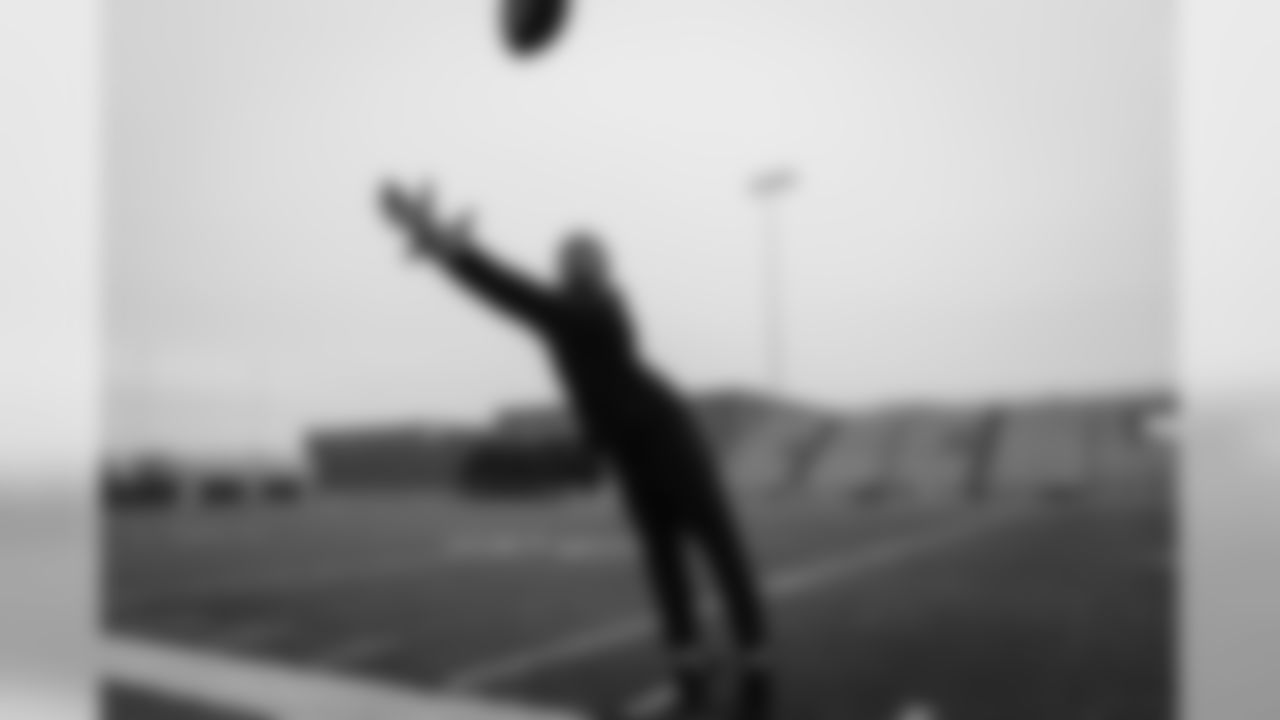 Receiver Doug Baldwin stretches for a pass as he practices tiptoe catches along the sidelines during walk thru.