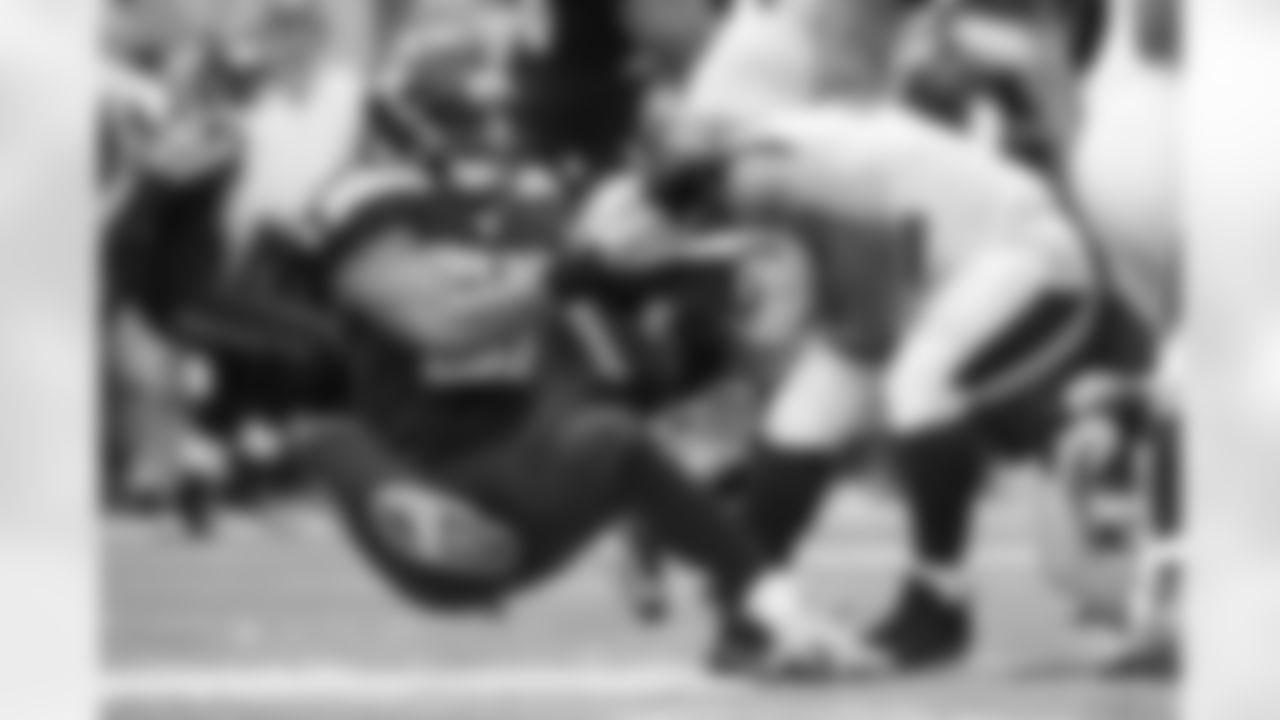 Linebacker Mike Morgan pulls down Maurice Jones-Drew in the fourth quarter.