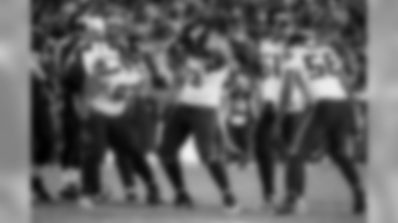 Michael Bennett does his patented sack dance as teammates Jordan Hill, Bruce Irvin and Cliff Avril watch him celebrate the sack.