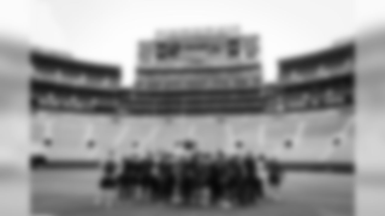 The Seahawks gather on the turf at Lambeau Field after a brief visit on Saturday.