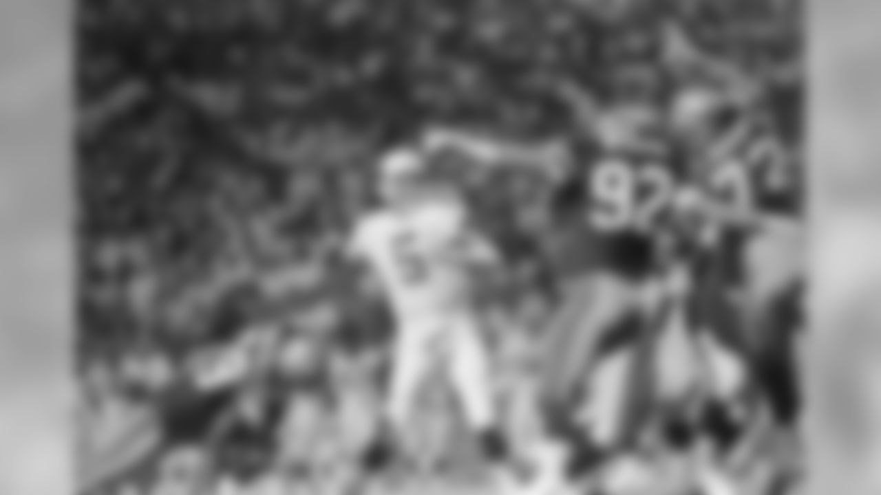 Phoenix Cardinals quarterback Gary Hogeboom can't find a receiver due to heavy defensive pressure from Seattle Seahawks (92) David Wyman and (72) Joe Nash during action in their pre-season game, Aug. 12, 1989 in Tempe, Arizona. The Seahawks proved too much for the Cardinals after the game went into overtime and lost 16-10. (AP Photo/Chad Surmick)