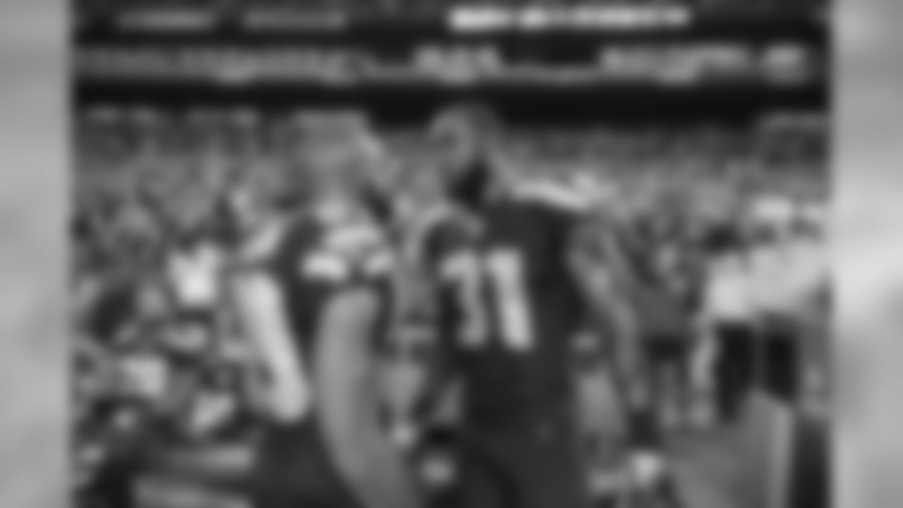 On the Seahawks sideline, Doug Baldwin talks to Kam Chancellor after Chancellor's game-saving play.