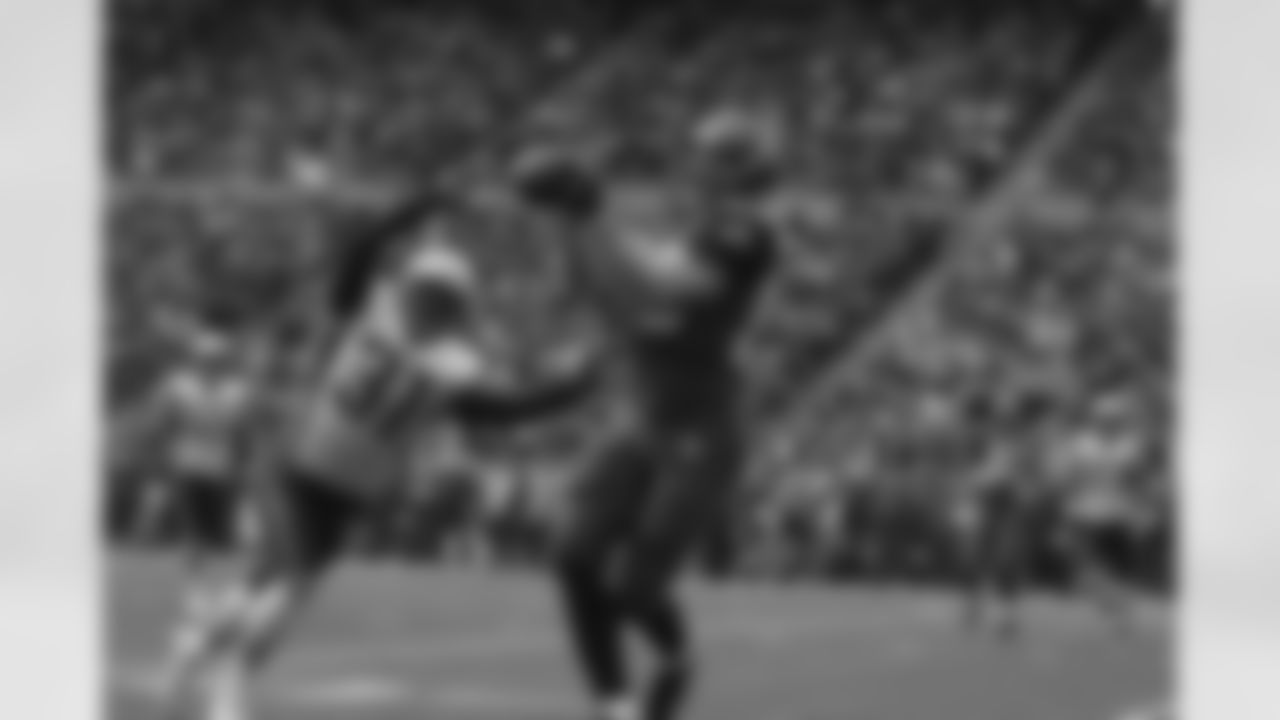 John Carlson makes a clutch reception against Brandon Meriweather.