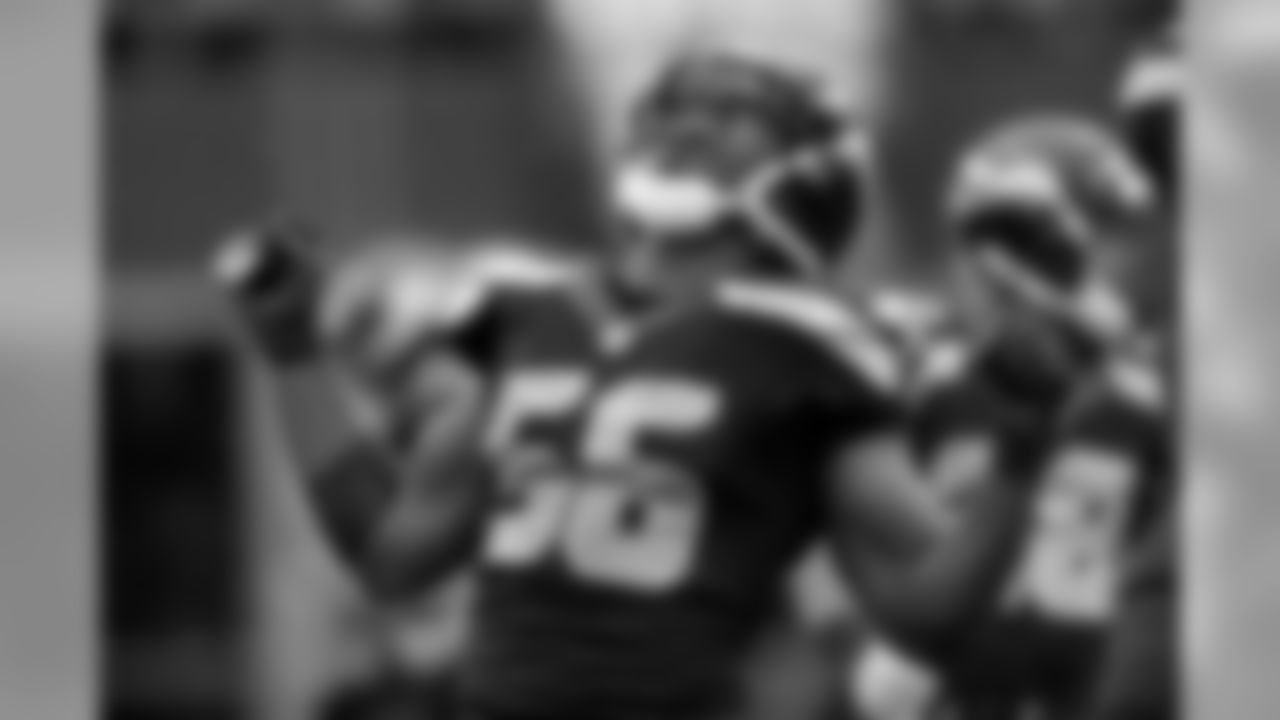 Cliff Avril celebrates after his big hit on Derek Carr.