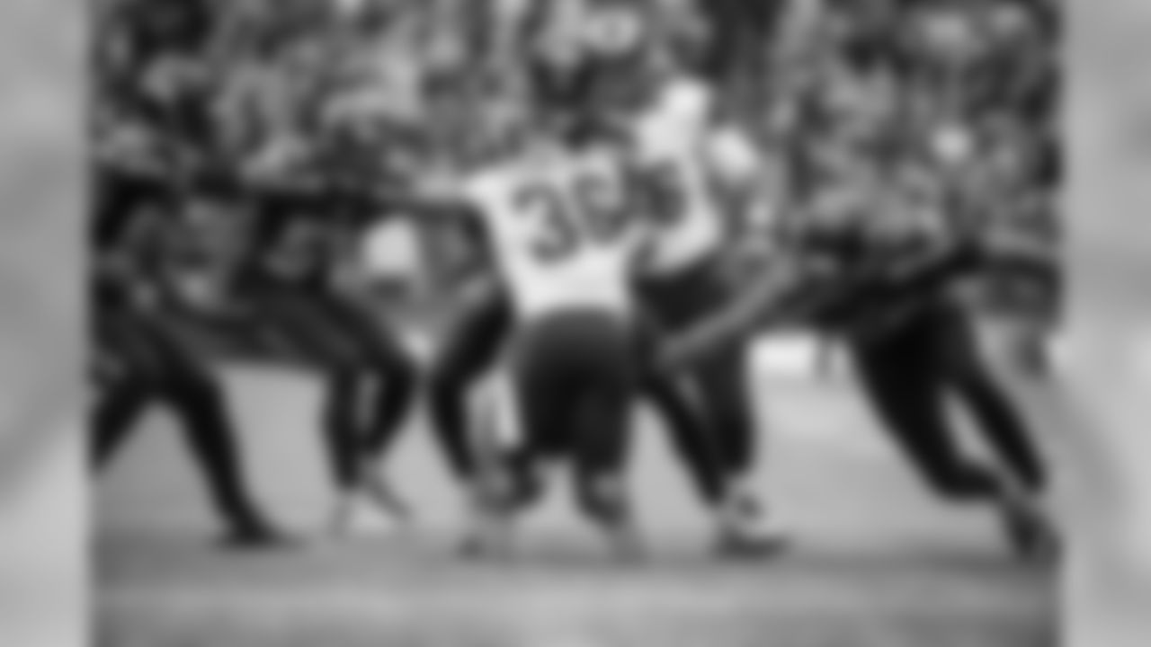 St. Louis back Benny Cunningham finds nowhere to run as he is met by a wall of Seahawks defenders including Cliff Avril, Bobby Wagner, Kam Chancellor and K.J. Wright.