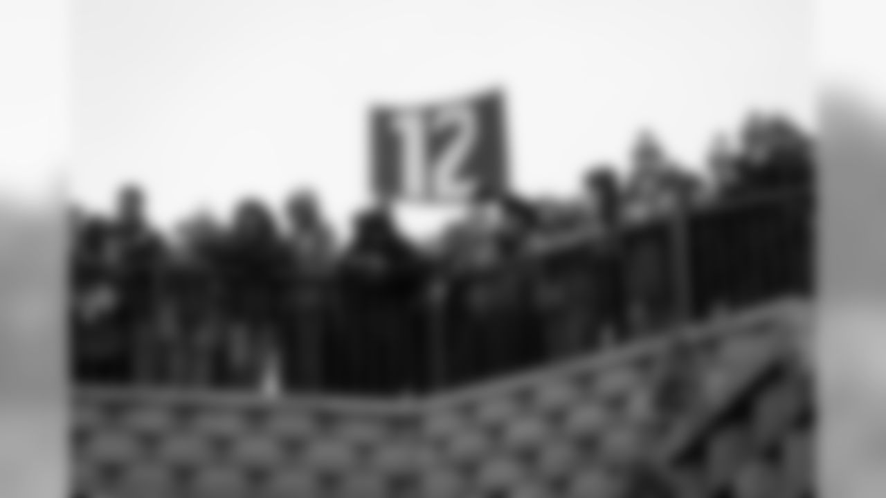 Seahawks fans mixed with Chiefs fans to watch the teams arrive at Arrowhead Stadium ahead of the game between their two teams.