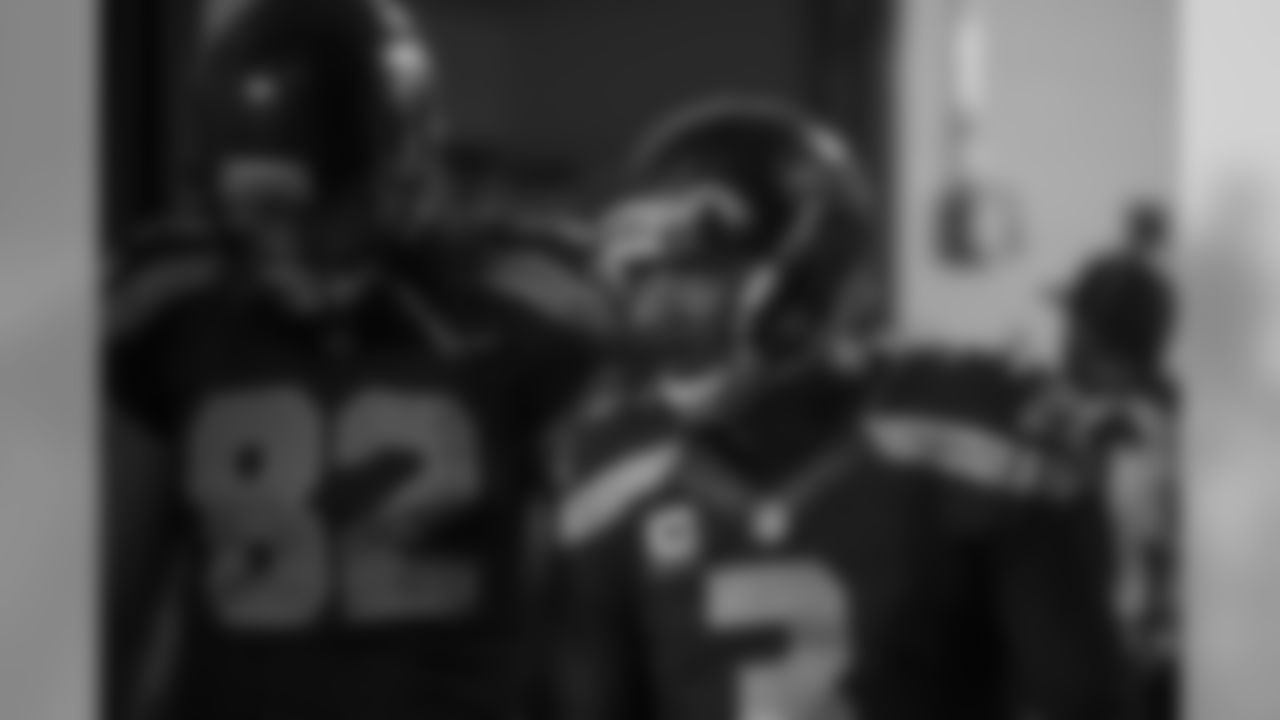 Russell Wilson, with Luke Willson, turns the corner out of the locker room and heads to the tunnel for pregame introductions.